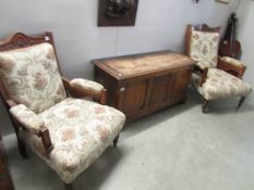 A pair of Edwardian arm chairs