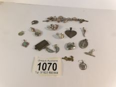 A silver charm bracelet and a quantity of loose silver charms