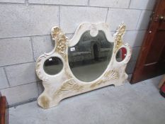 A shabby chic overmantel mirror