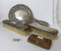 A silver hand mirror,