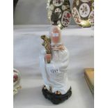 An Edwardian figure of an oriental gentleman as a table lamp