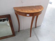 A walnut D shaped table