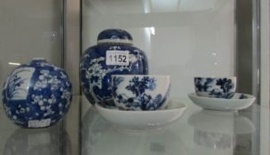 2 Oriental blue and white tea cups and saucers together with a ginger jar and a small vase