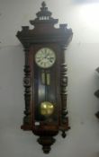 A Victorian mahogany double weight Vienna wall clock