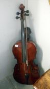 A cello with bows and soft case