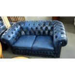A blue leather 2 seater Chesterfield sofa