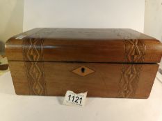 A mahogany inlaid sewing box