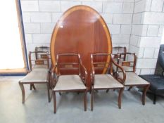 A large oval tip top loo table together with 2 brass inlaid carvers and 4 dining chairs