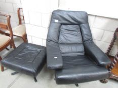 A black leather chair and matching stool