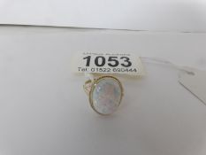A 9ct gold ring set large oval opal,