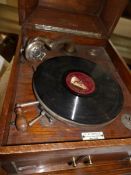 A wood cased wind up gramaphone (in working order)