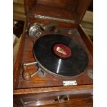 A wood cased wind up gramaphone (in working order)