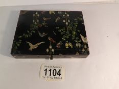 A papier mache' box painted with birds