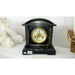 A wooden palladian style mantel clock