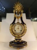 A Victorian and Albert museum reproduction Marie Antionette porcelain clock in the Sevres style