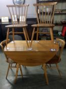 An Ercol table and 4 chairs