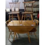 An Ercol table and 4 chairs