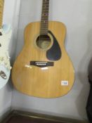 A Yamaha F310 acoustic guitar