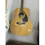 A Yamaha F310 acoustic guitar