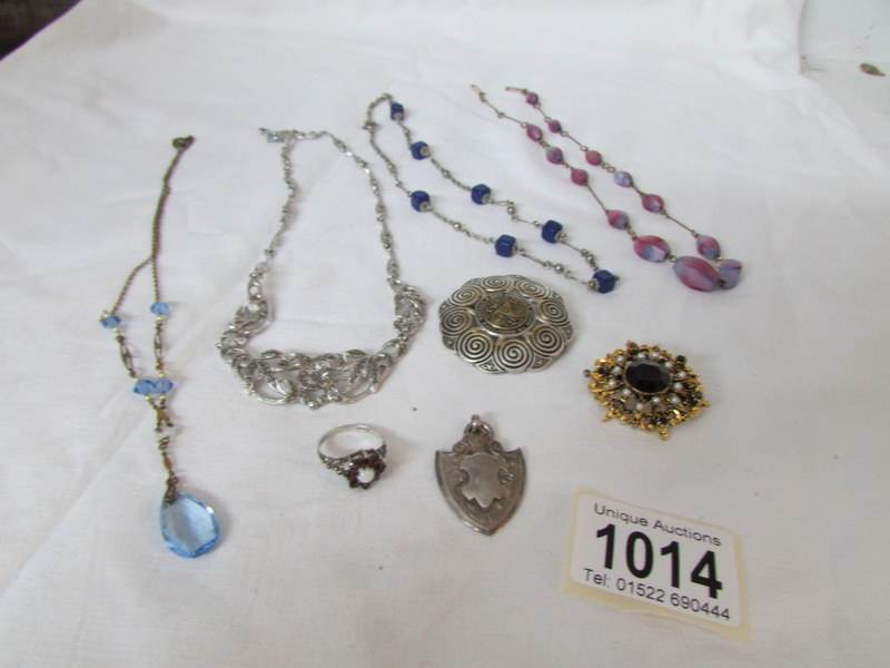 A mixed lot of costume jewellery including silver ring and silver fob