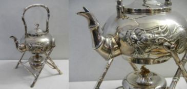 A 19th century white metal teapot (possibly Chinese silver) of Chinese design featuring an oriental