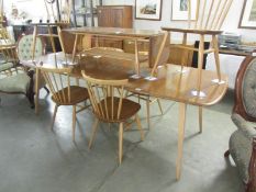 An Ercol extending dining table and 6 chairs