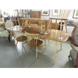 An Ercol extending dining table and 6 chairs