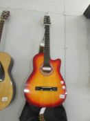 A Dynasun electric/acoustic guitar with soft case