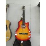 A Dynasun electric/acoustic guitar with soft case