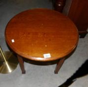 A circular oak coffee table