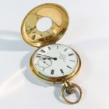 An 18ct gold half hunter pocket watch with enamel dial by Dent of London