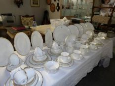 In excess of 100 pieces of Royal Doulton Gold Concord tea and dinner ware