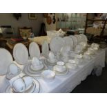 In excess of 100 pieces of Royal Doulton Gold Concord tea and dinner ware