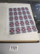 An album of mint and used GB stamps including full sheets, blocks,