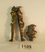 An early Punch and Judy nutcrackers and a silver Punch rattle top
