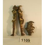 An early Punch and Judy nutcrackers and a silver Punch rattle top