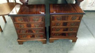 A pair of small 2 over 3 chests of drawers