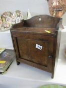 A wooden smokers cabinet