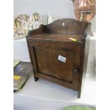 A wooden smokers cabinet