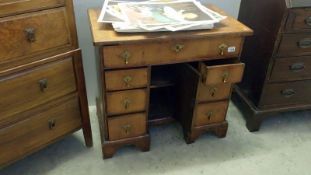 A Queen Ann kneehole desk