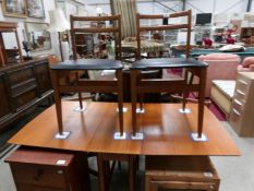 A drop leaf table and 4 chairs