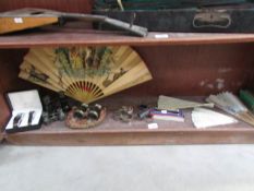 A mixed lot including fans, opera glasses, silver napkin ring,