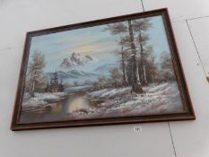 A gilt framed oil on canvas mountain scene