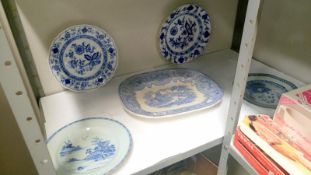 A blue and white platter and 4 blue and white plates