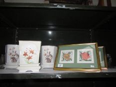 3 ceramic planters on stands and 2 framed and glazed tapestries