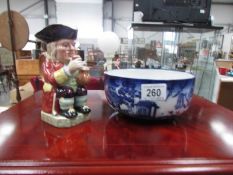 A Beswick Toby jug and a Royal Doulton blue and white willow pattern bowl
