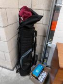 A quantity of graphite shafted golf clubs with bag, trolley,