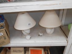 A pair of table lamps with shades