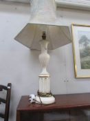 A ceramic table lamp with shade