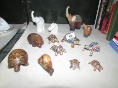 A quantity of Wade tortoises and wooden animals